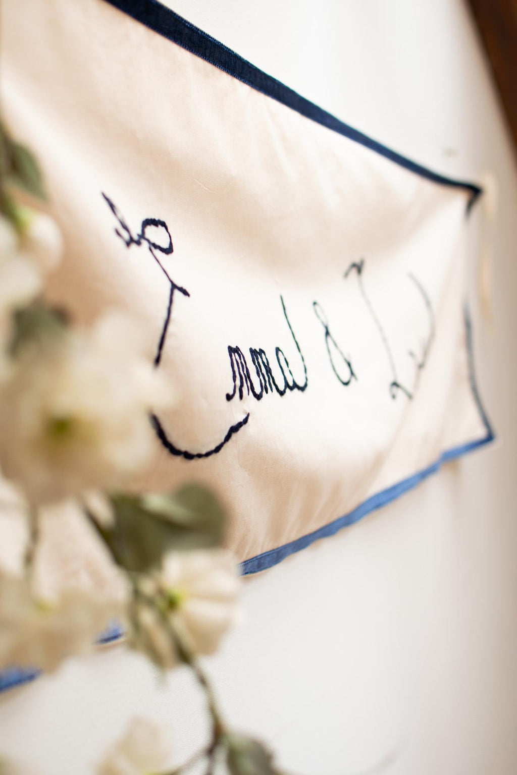 Decorative banner with text and floral elements in the foreground